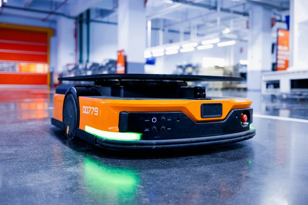 Illustration — autonomous patrol robot on the warehouse floor